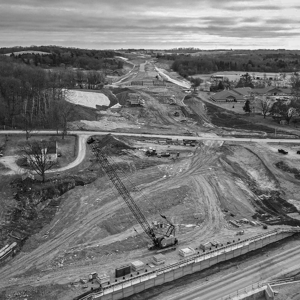 A large-scale construction site where a highway is being built.